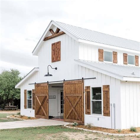 white barn brown roof